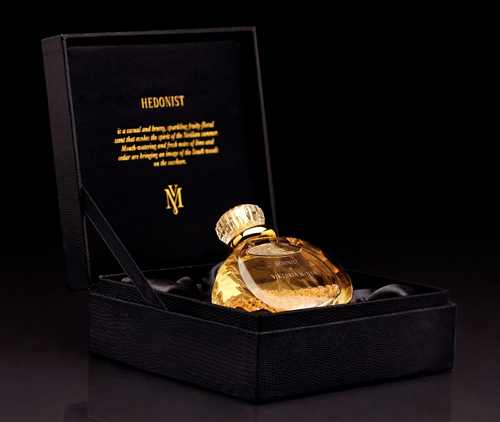 Hedonist in its handmade wooden box that is "fashioned to capture the sleek look and feel of snakeskin leather."